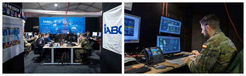 Op de foto’s zijn Duitse en Spaanse militairen te zien die achter hun computer werken.